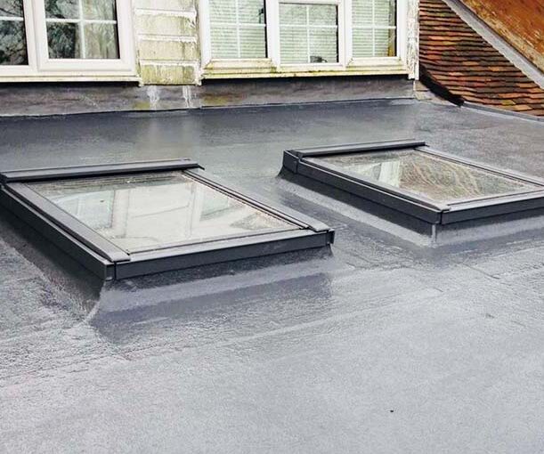 Flat kitchen roof black colour resurfaced with 2 Sky lights